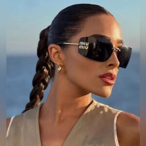 Miu Miu Eyewear logo-plaque frameless sunglasses